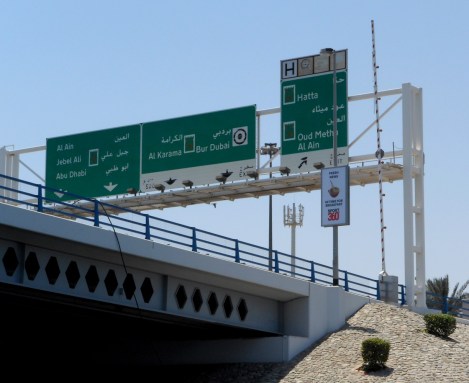 Dubai highway signs from the river.